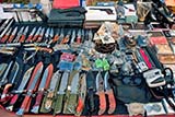 Knives, guns, knuckle dusters, etc., at Hat Yai Nai Sunday market - Click for larger image Knives, guns, knuckle dusters, etc., at Hat Yai Nai Sunday market - Click for larger image